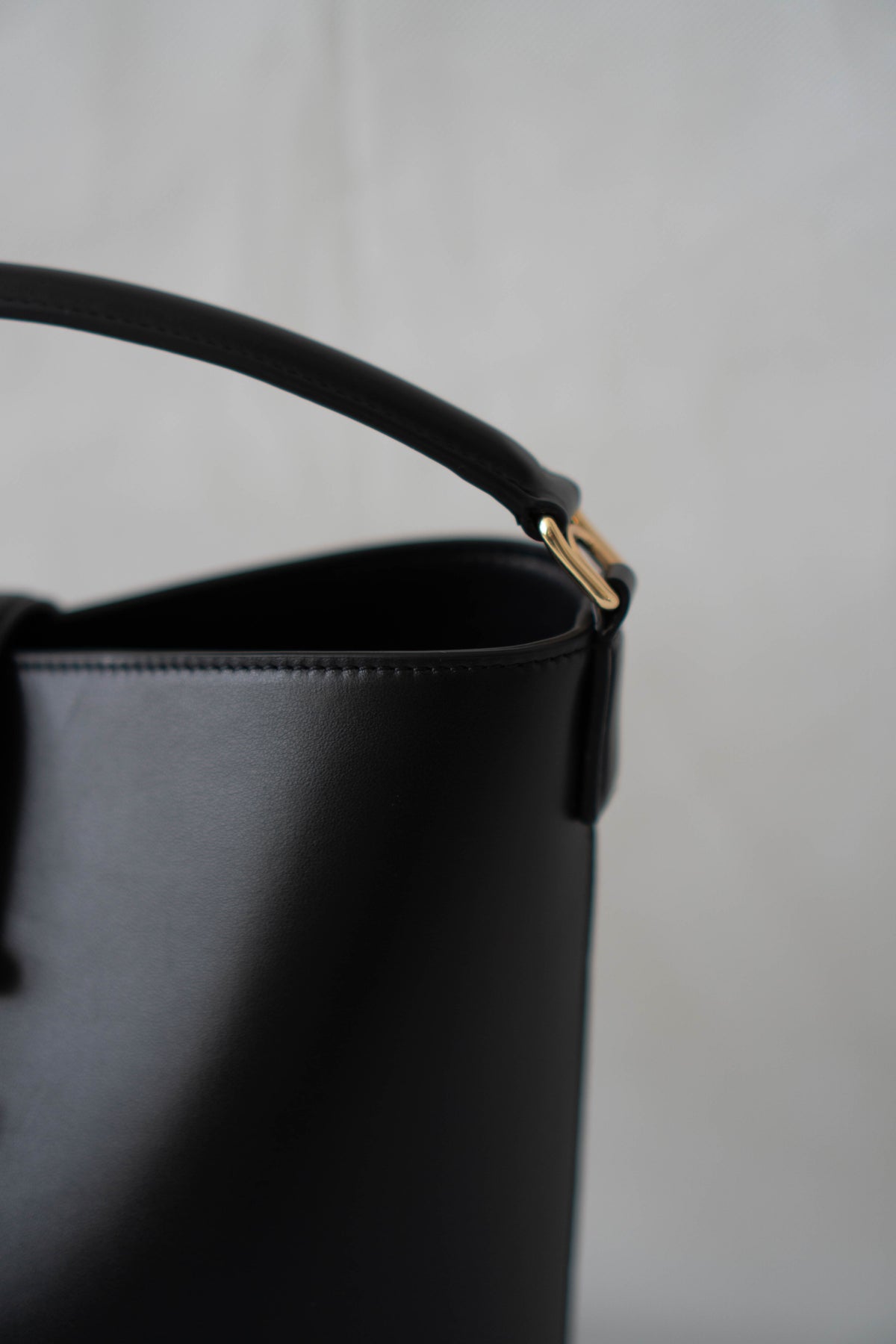 Triomphe Medium Bucket Bag – Black Smooth Calfskin in Gold Hardware