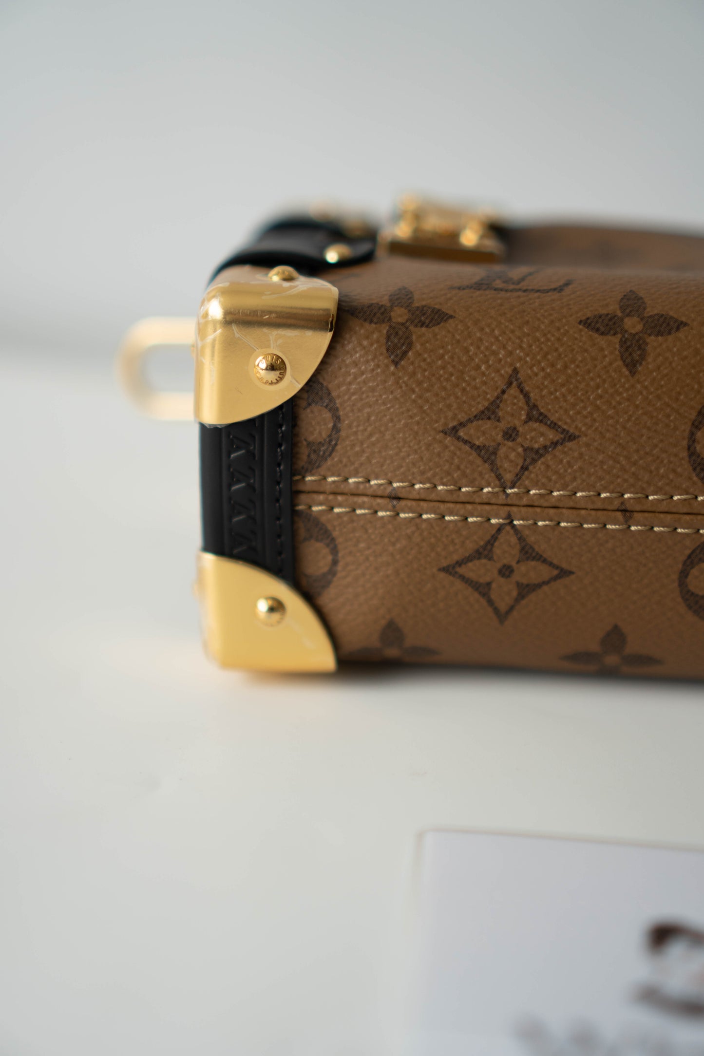 Side Trunk in PM Reverse Monogram with Gold Hardware