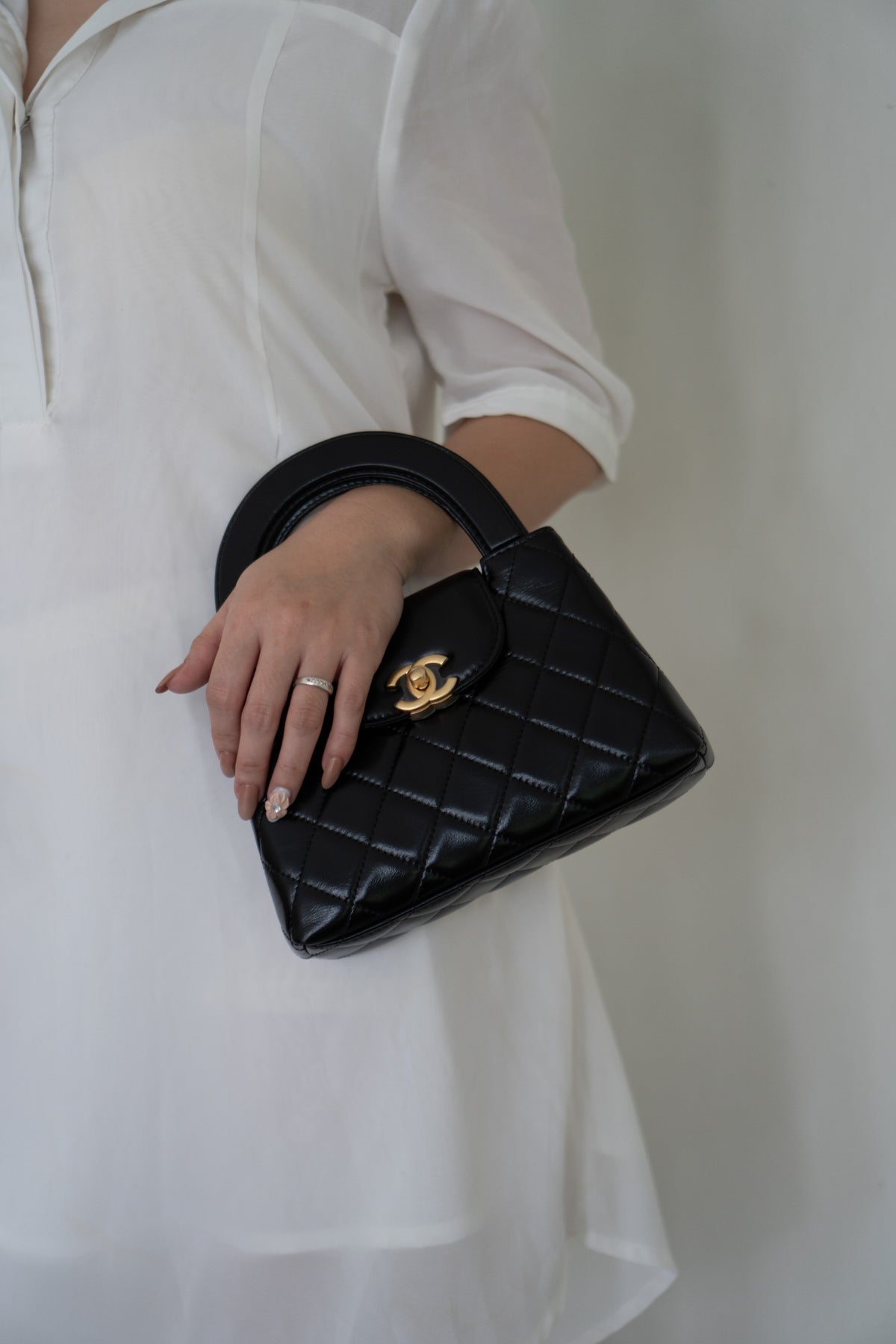 CC Kelly Quilted Top Handle Bag – Black Lambskin with Gold Hardware
