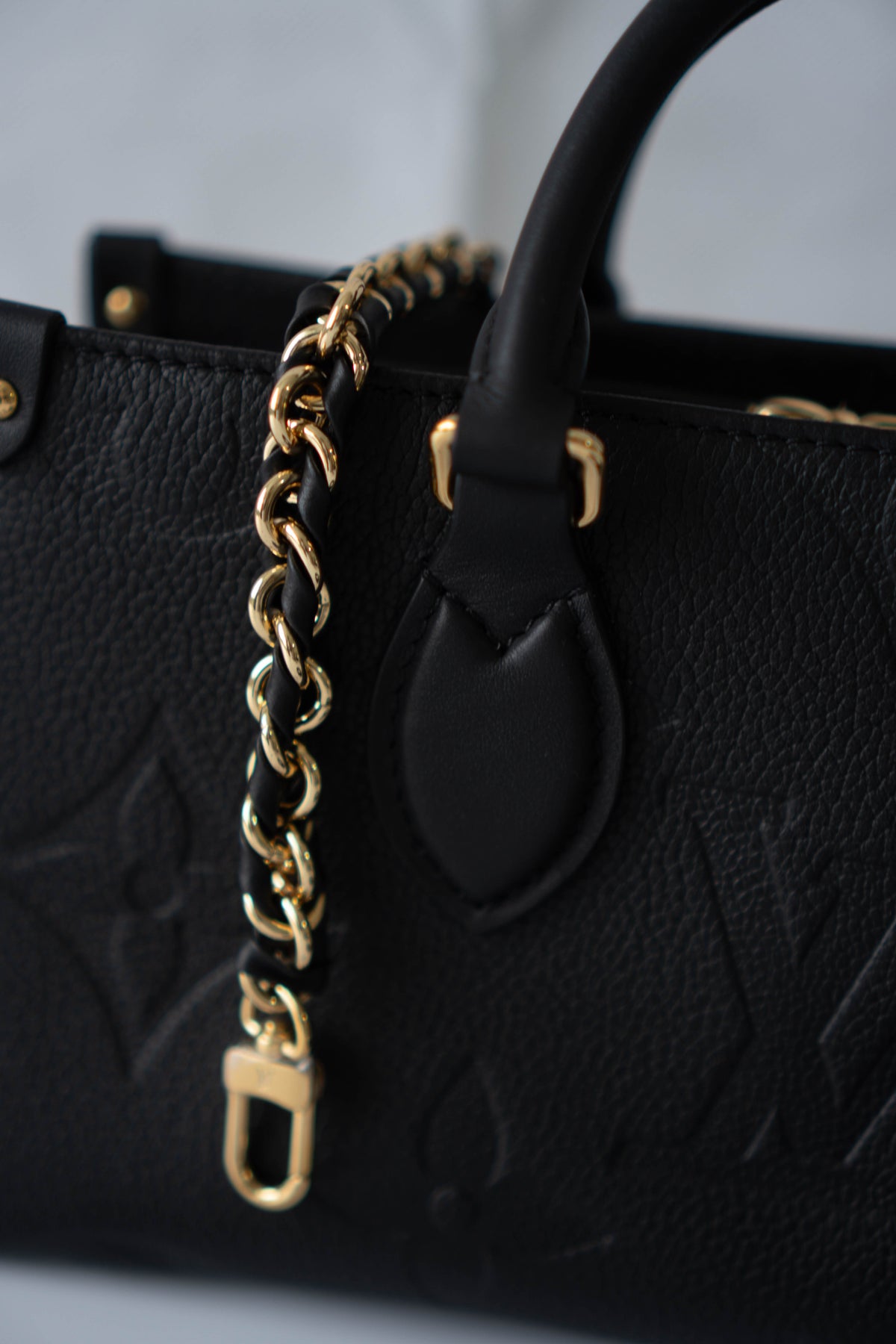 On-The-Go East West – Black Monogram Empreinte Leather with Gold Hardware