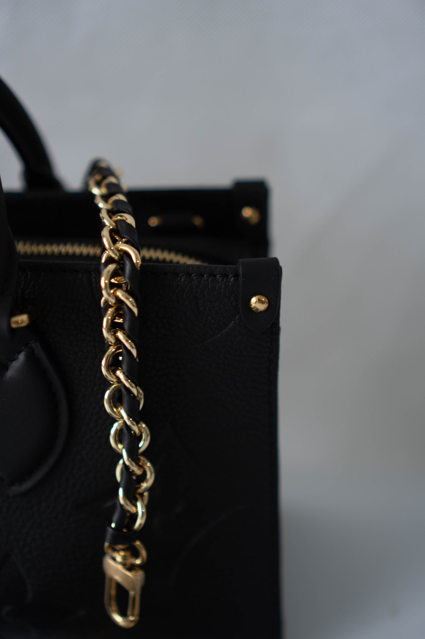 On-The-Go East West – Black Monogram Empreinte Leather with Gold Hardware