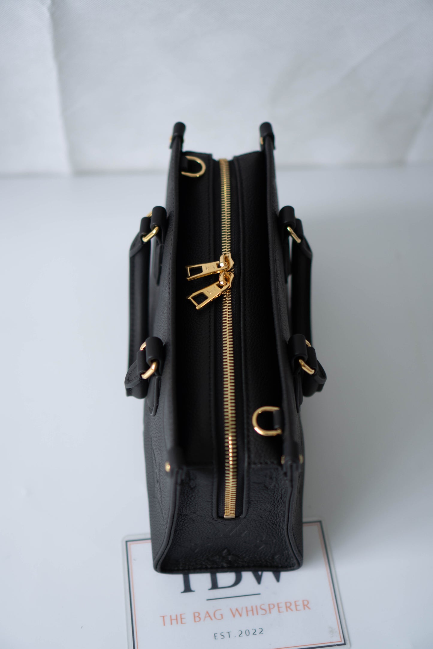 On-The-Go East West – Black Monogram Empreinte Leather with Gold Hardware