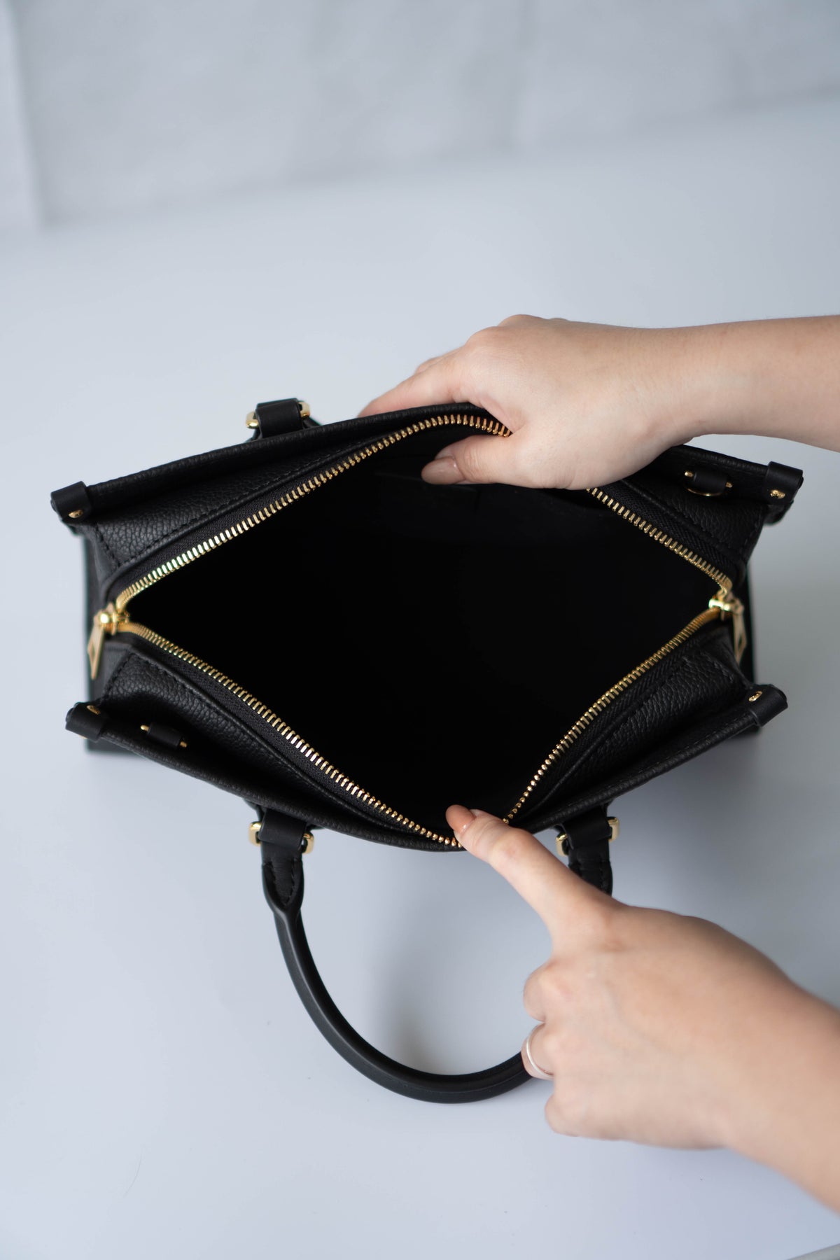 On-The-Go East West – Black Monogram Empreinte Leather with Gold Hardware