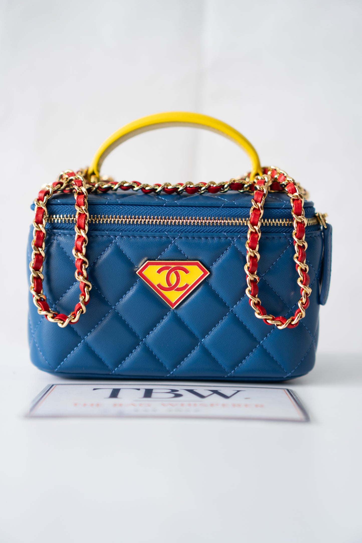 Small Vanity Case (Superman) with Top Handle – Blue Quilted Lambskin with Superhero Emblem &amp; Gold Hardware