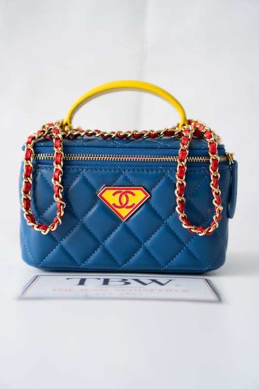 Small Vanity Case (Superman) with Top Handle – Blue Quilted Lambskin with Superhero Emblem &amp; Gold Hardware