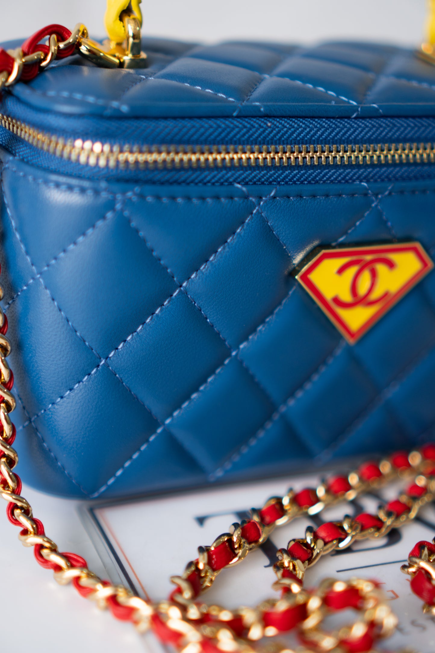 Small Vanity Case (Superman) with Top Handle – Blue Quilted Lambskin with Superhero Emblem &amp; Gold Hardware