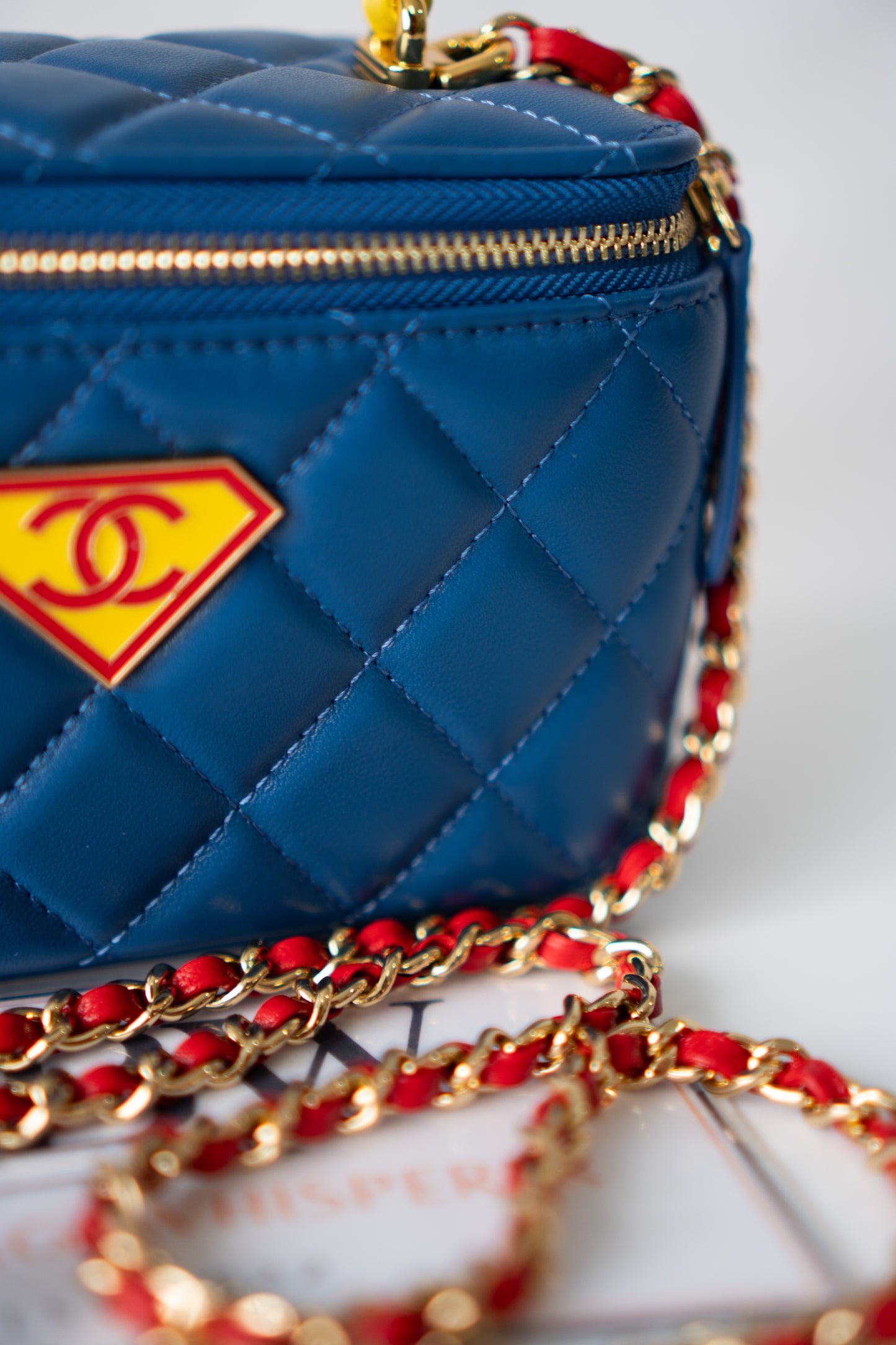 Small Vanity Case (Superman) with Top Handle – Blue Quilted Lambskin with Superhero Emblem &amp; Gold Hardware