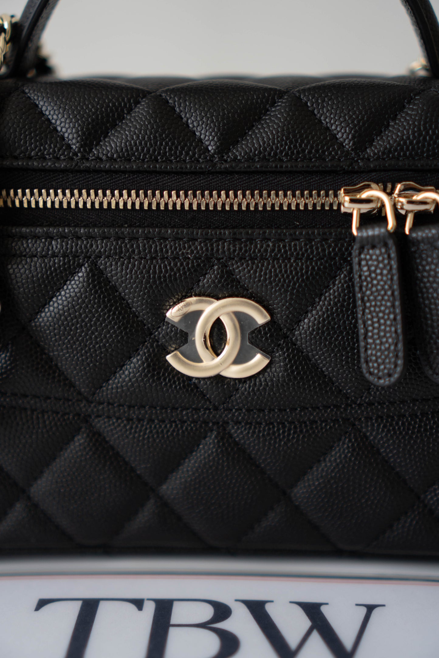 Top Handle Slim Vanity Case – Black Quilted Leather with Gold Hardware
