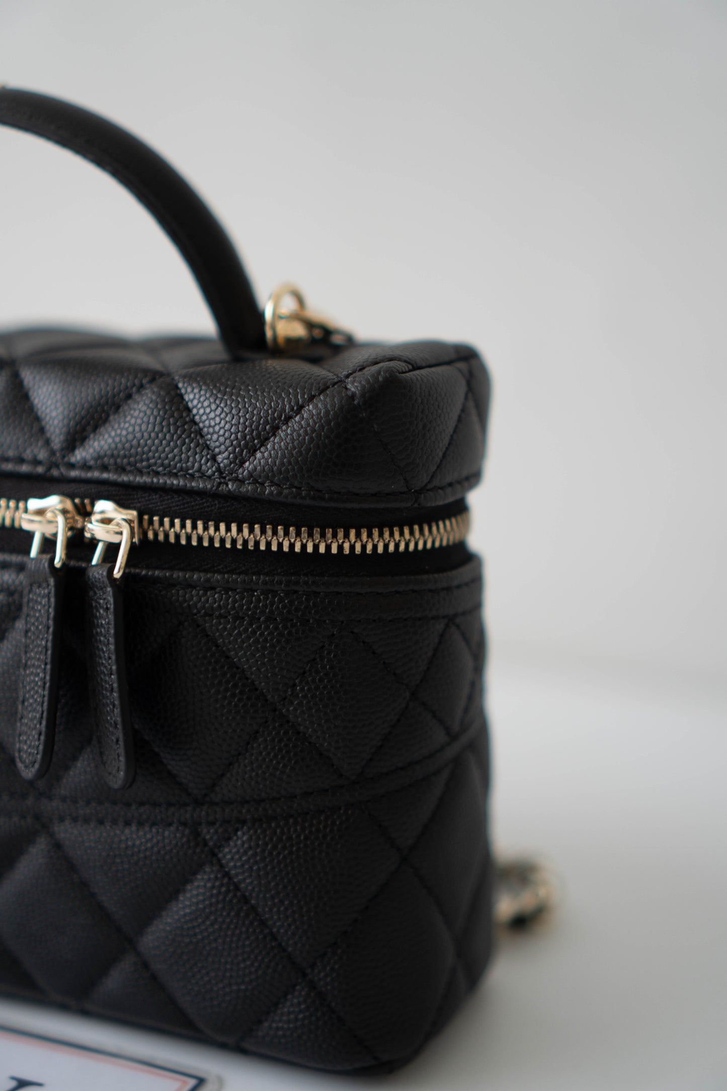 Top Handle Slim Vanity Case – Black Quilted Leather with Gold Hardware