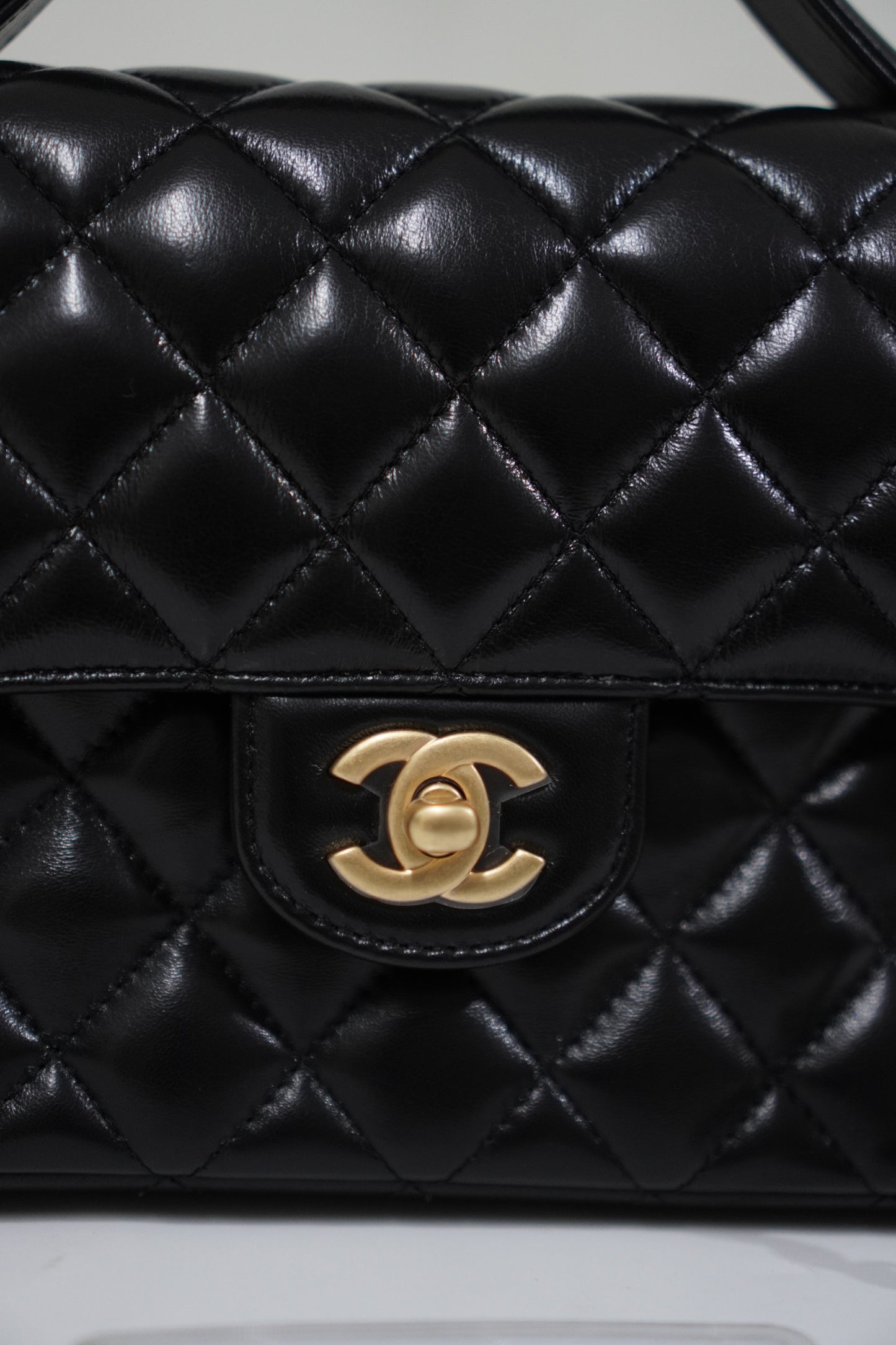 25P Top Handle Flap Bag in Black Shiny Lambskin with Gold Hardware